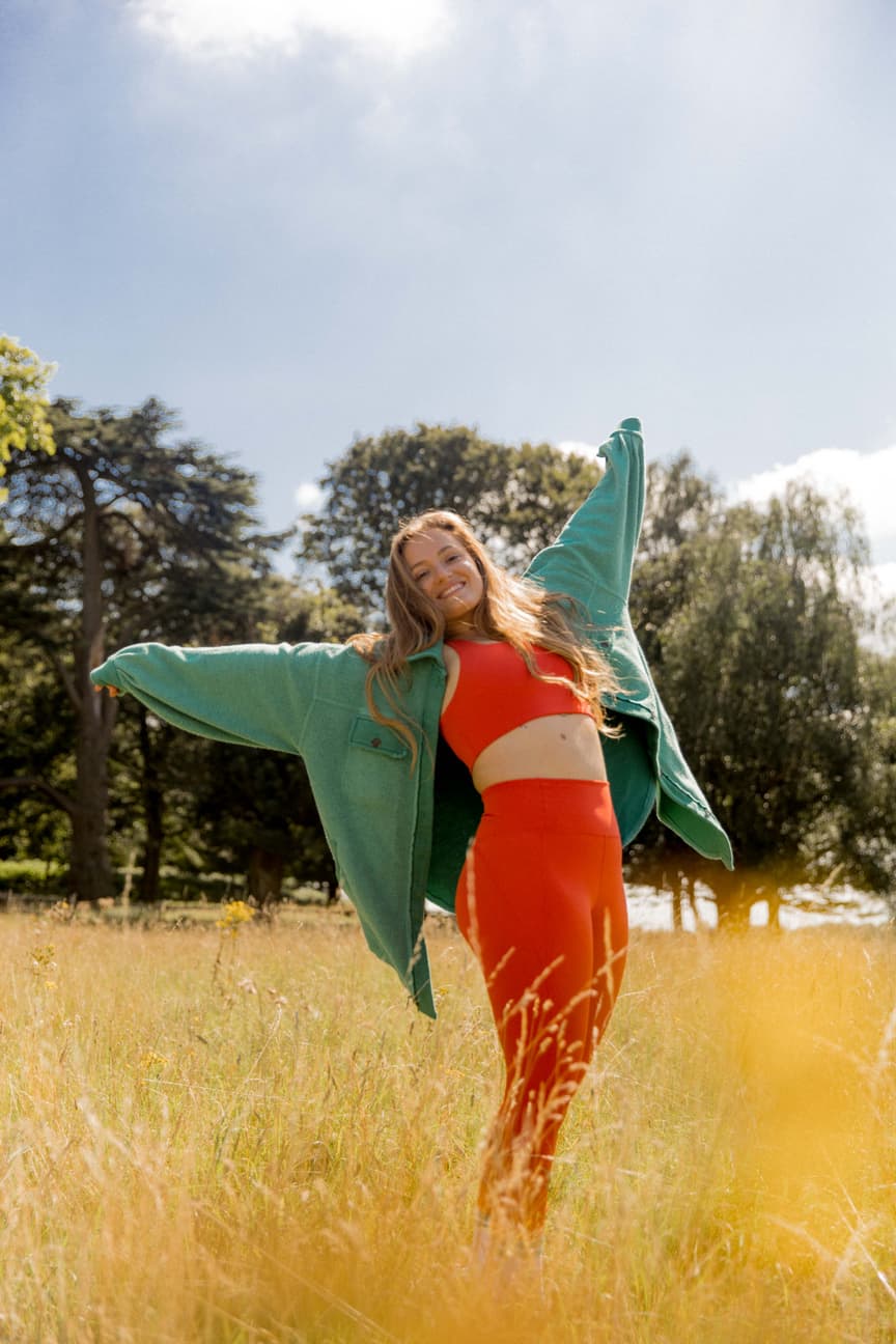Lashara Wood, personal trainer and mindset coach, outdoors in a field