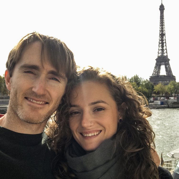Couple in Paris in front of Eiffel Tower